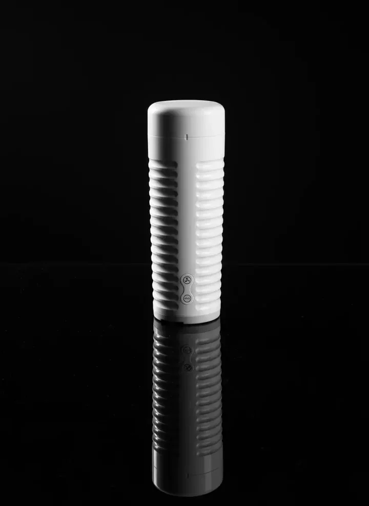 Lovense Max 2 standing upright on a reflective black surface